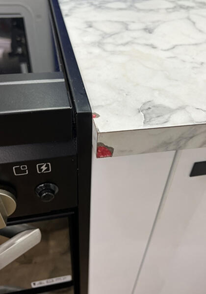 Kitchen laminate benchtop chip repairs - before photo