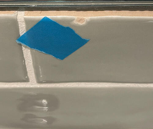 Kitchen tile splashback chip repair - before photo