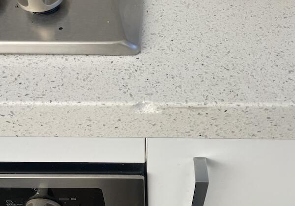 FIX 'N' CHIPS stone benchtop with a chip on the edge