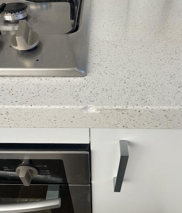 FIX 'N' CHIPS stone benchtop with a chip on the edge